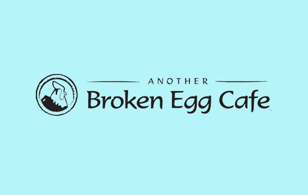 Logo for Another Broken Egg Cafe with a circular emblem on a light blue background.