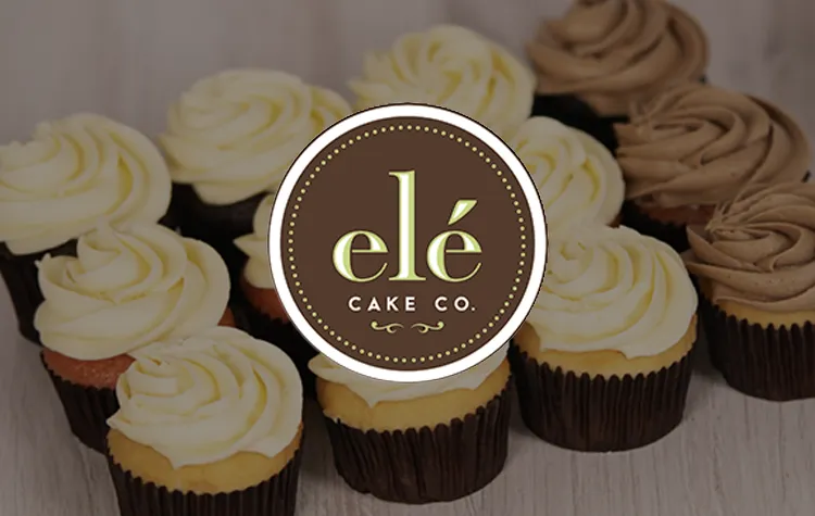 Cupcakes with vanilla and chocolate frosting arranged around a brown circular Elé Cake Co. logo in the center.