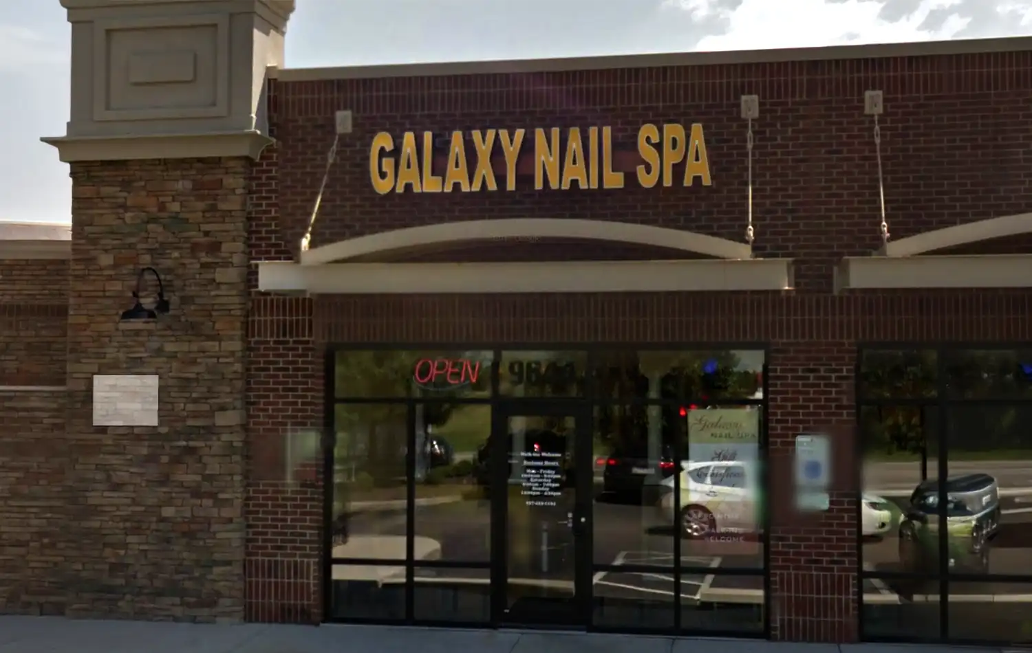 Galaxy Nail Spa Galaxy Nail Spa storefront with a brick facade and glass entrance doors.