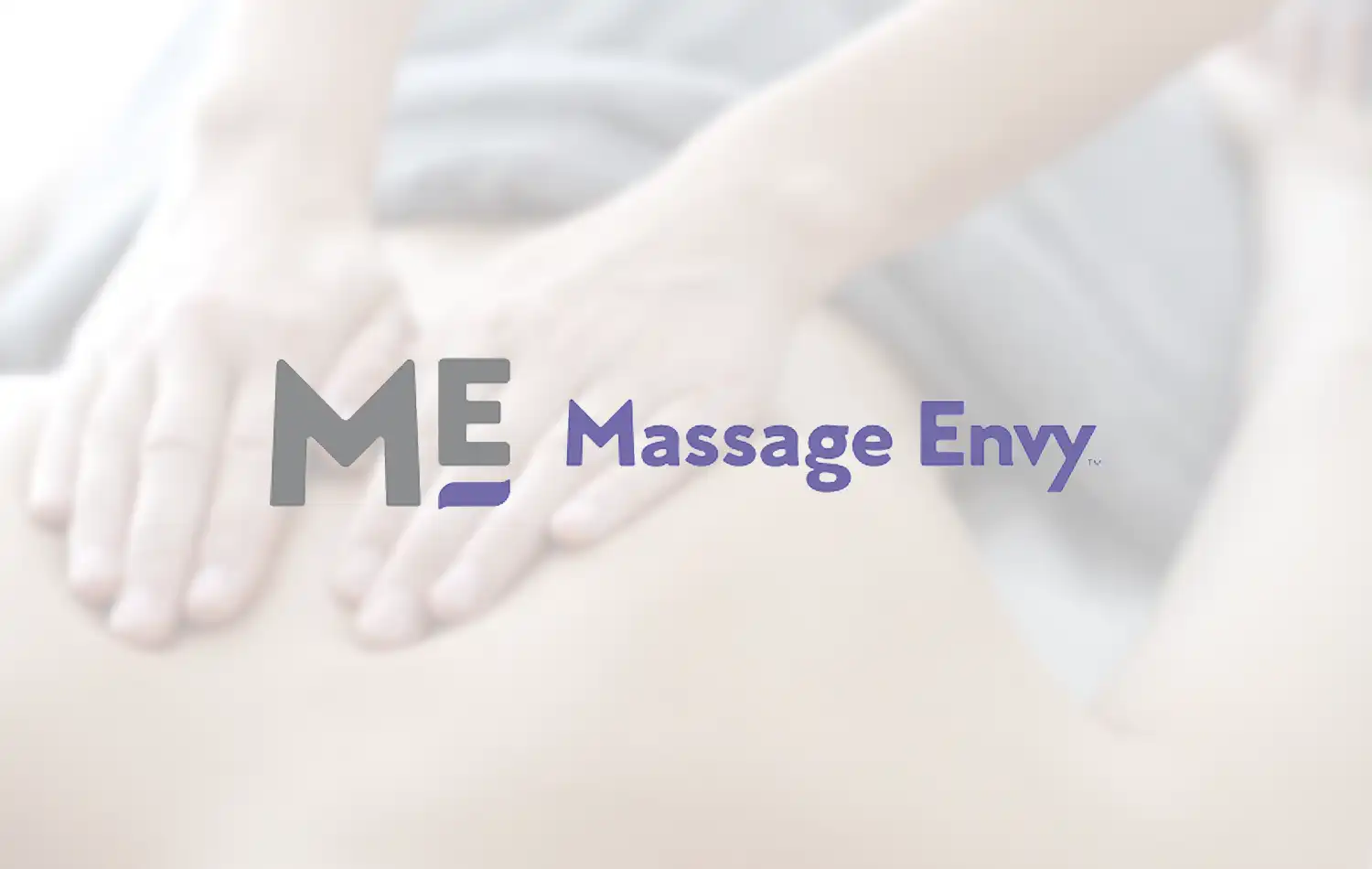 Massage Envy Hands massaging a person's back with the Massage Envy logo overlaid.